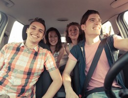 Young adults in a car traveling